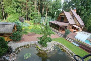 Фото номера Бунгало Делюкс с видом на сад Дома для отпуска Dream forest house of Kaunas Reservoir г. Šlienava 46